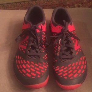 New Balance  Minimus tennis shoes. Red and blue.